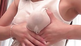 Close-up of well-oiled tits got squeezed